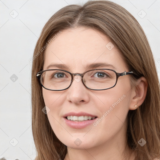 Joyful white young-adult female with long  brown hair and blue eyes