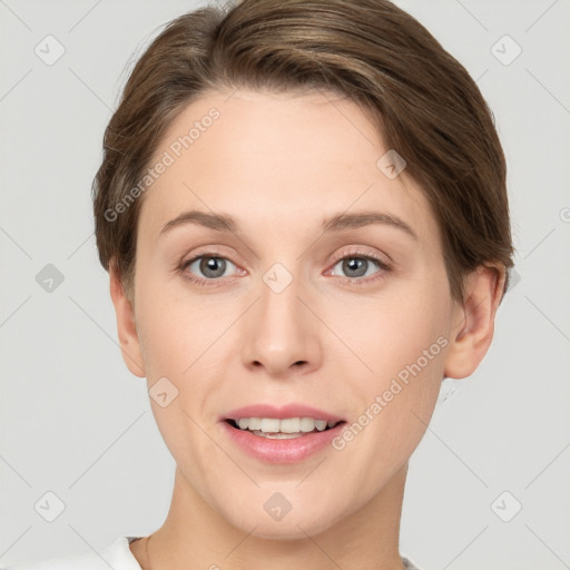 Joyful white young-adult female with short  brown hair and grey eyes