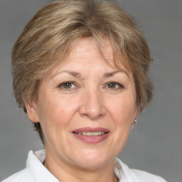 Joyful white middle-aged female with short  brown hair and brown eyes