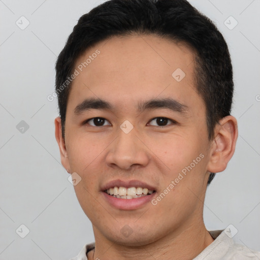 Joyful white young-adult male with short  black hair and brown eyes