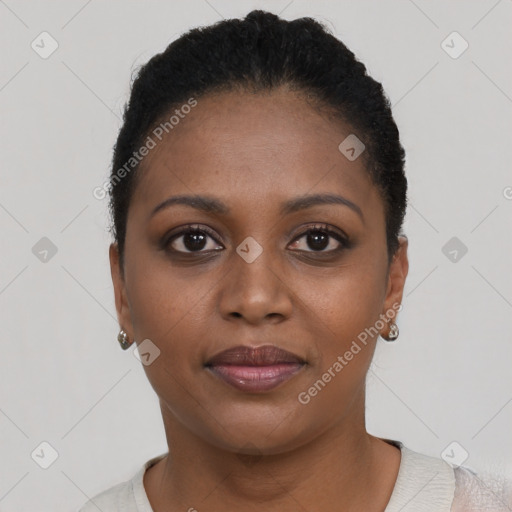 Joyful black young-adult female with short  brown hair and brown eyes