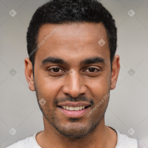 Joyful black young-adult male with short  black hair and brown eyes