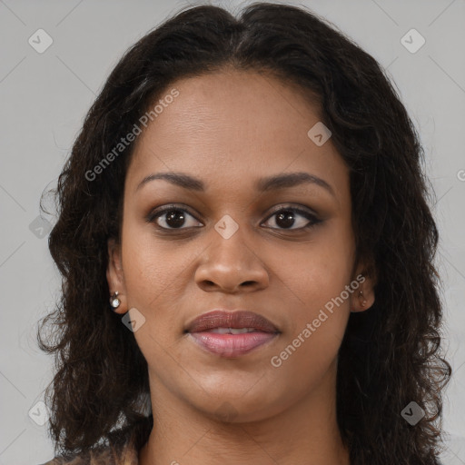 Joyful black young-adult female with long  brown hair and brown eyes