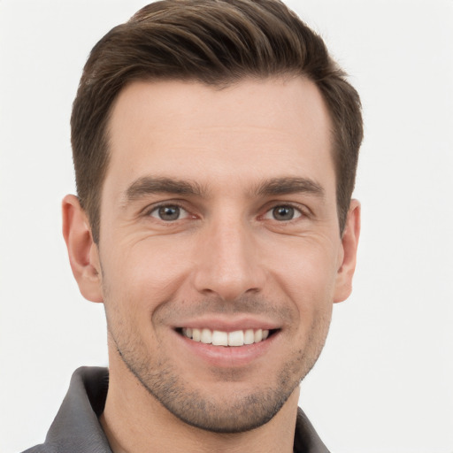 Joyful white young-adult male with short  brown hair and brown eyes