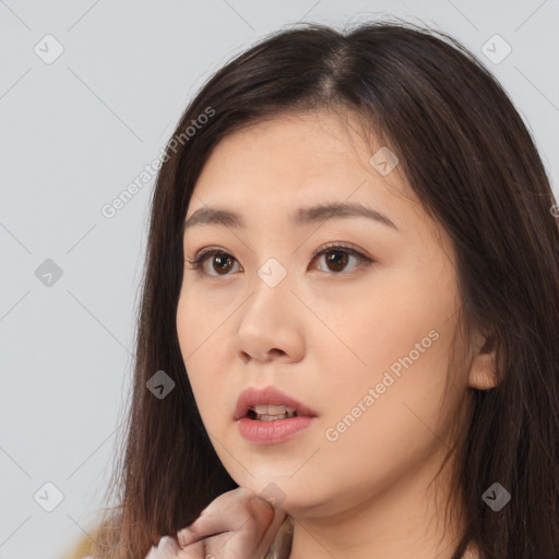 Neutral white young-adult female with long  brown hair and brown eyes