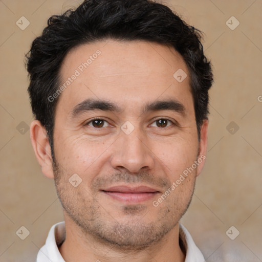 Joyful white adult male with short  black hair and brown eyes