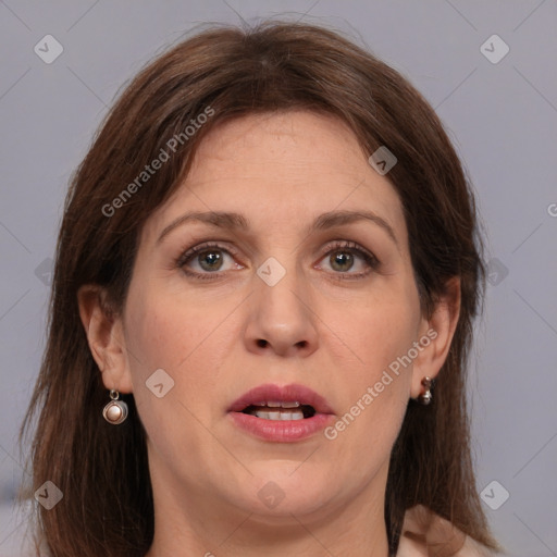 Joyful white adult female with medium  brown hair and grey eyes