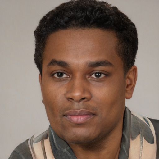 Neutral black young-adult male with short  black hair and brown eyes
