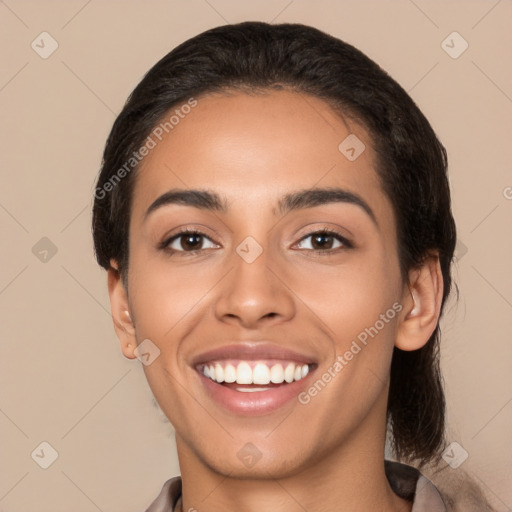 Joyful latino young-adult female with short  black hair and brown eyes