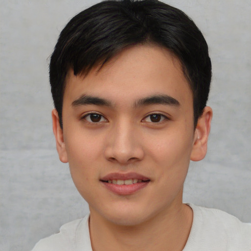 Joyful asian young-adult male with short  brown hair and brown eyes