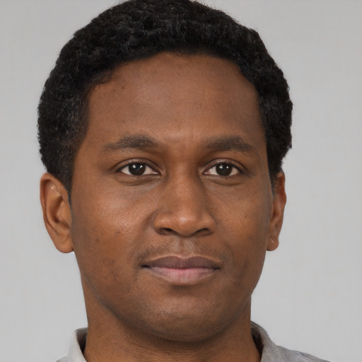 Neutral black young-adult male with short  brown hair and brown eyes