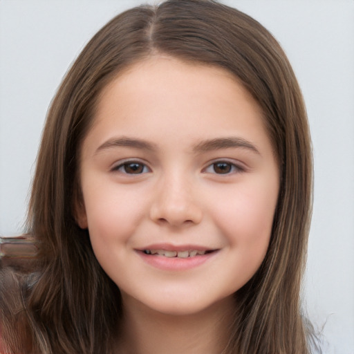 Joyful white child female with long  brown hair and brown eyes