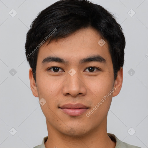 Joyful asian young-adult male with short  black hair and brown eyes