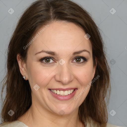 Joyful white adult female with medium  brown hair and brown eyes