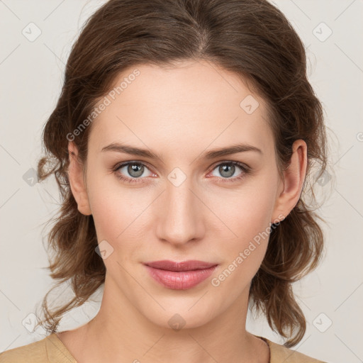 Joyful white young-adult female with medium  brown hair and green eyes