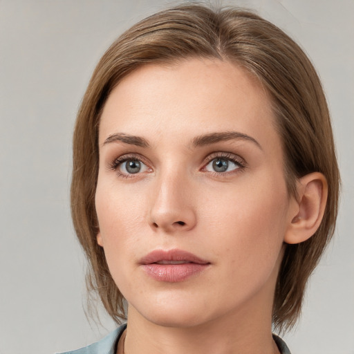 Neutral white young-adult female with medium  brown hair and grey eyes