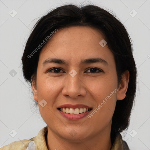 Joyful latino young-adult female with medium  brown hair and brown eyes