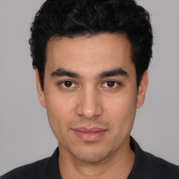 Neutral white young-adult male with short  black hair and brown eyes