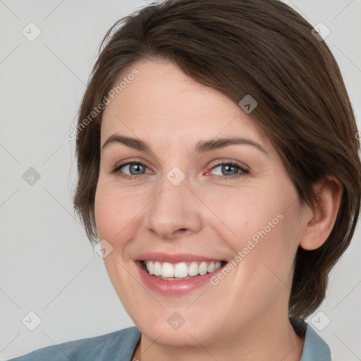 Joyful white young-adult female with medium  brown hair and green eyes