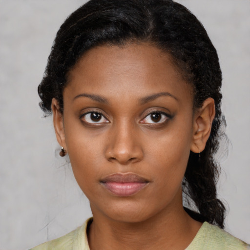 Neutral black young-adult female with medium  black hair and brown eyes