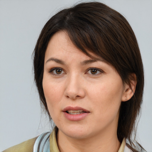 Neutral white young-adult female with medium  brown hair and brown eyes