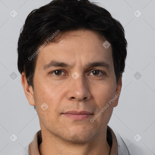 Joyful white adult male with short  brown hair and brown eyes