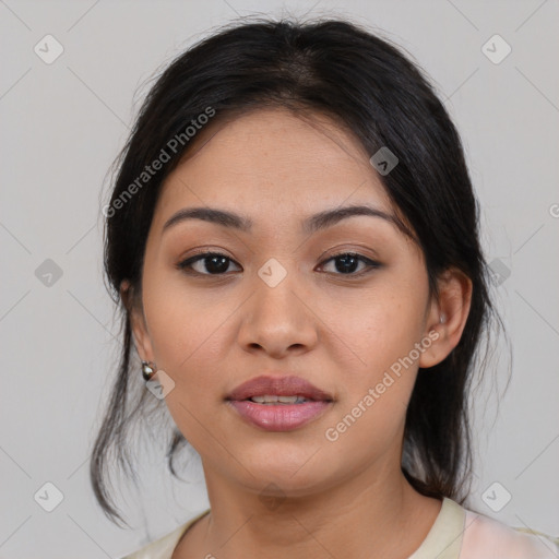 Joyful asian young-adult female with medium  black hair and brown eyes