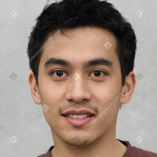 Joyful latino young-adult male with short  black hair and brown eyes