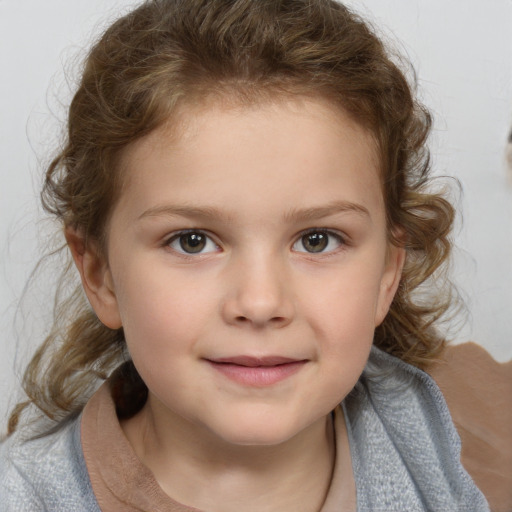 Joyful white child female with medium  brown hair and grey eyes