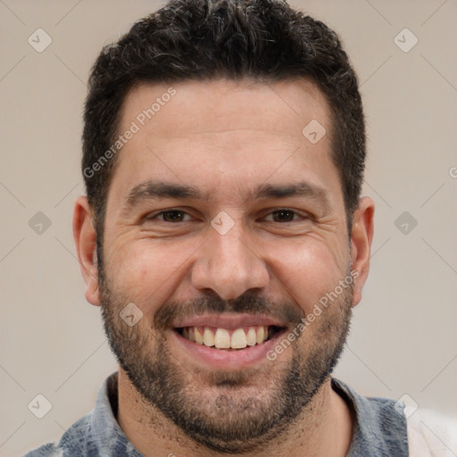 Joyful white adult male with short  brown hair and brown eyes