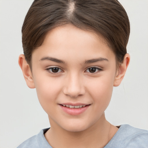 Joyful white child female with short  brown hair and brown eyes