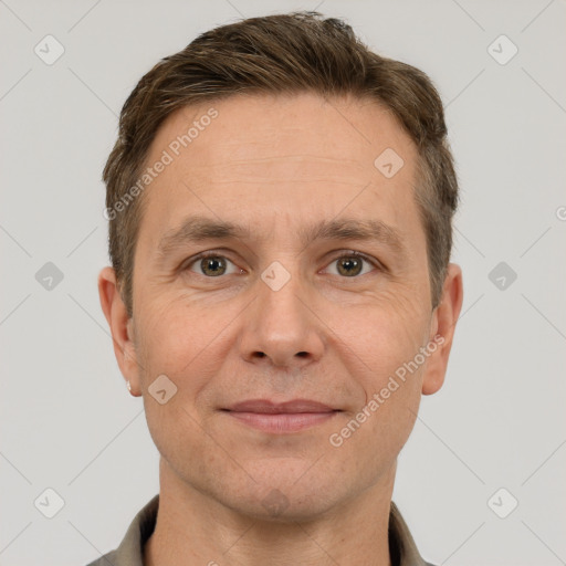 Joyful white adult male with short  brown hair and grey eyes