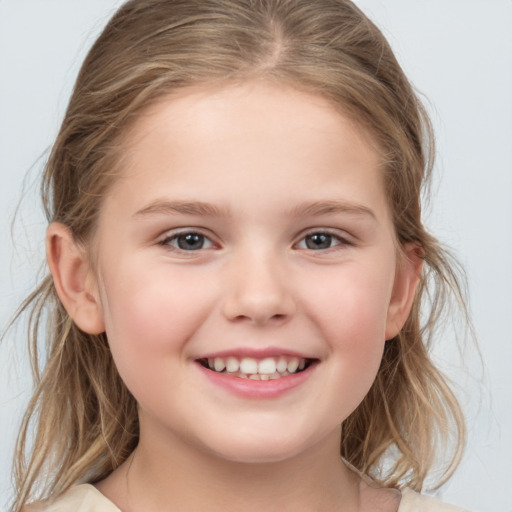 Joyful white child female with medium  brown hair and grey eyes