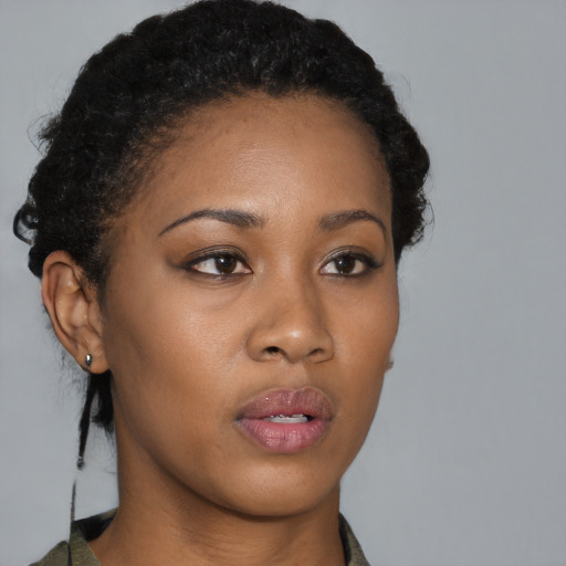 Neutral black young-adult female with short  black hair and brown eyes