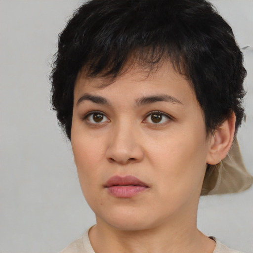 Joyful asian young-adult female with short  brown hair and brown eyes