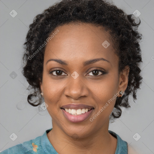 Joyful black young-adult female with medium  brown hair and brown eyes