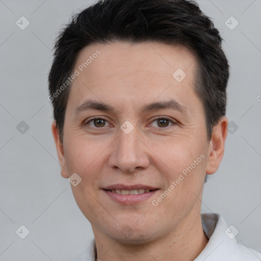 Joyful white adult male with short  brown hair and brown eyes