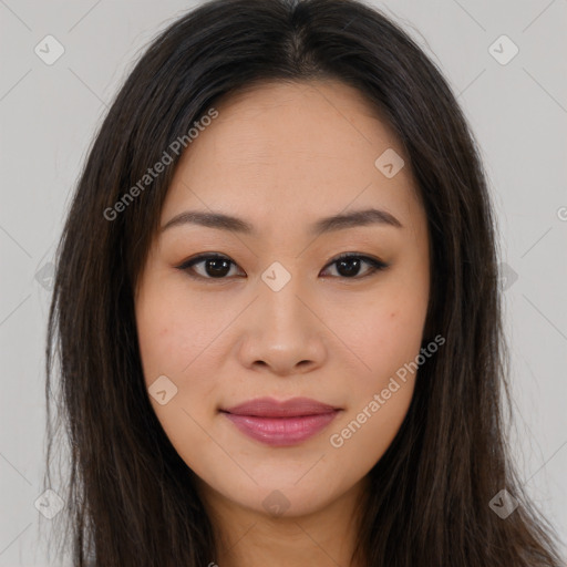 Joyful asian young-adult female with long  brown hair and brown eyes