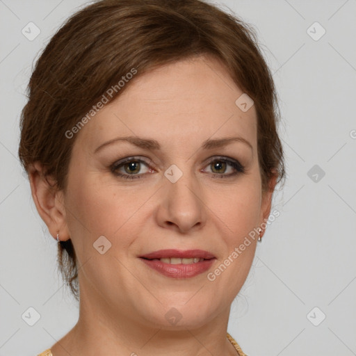 Joyful white adult female with medium  brown hair and green eyes