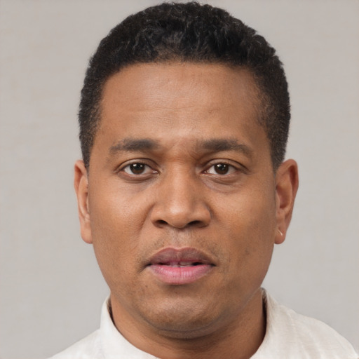 Neutral latino adult male with short  brown hair and brown eyes