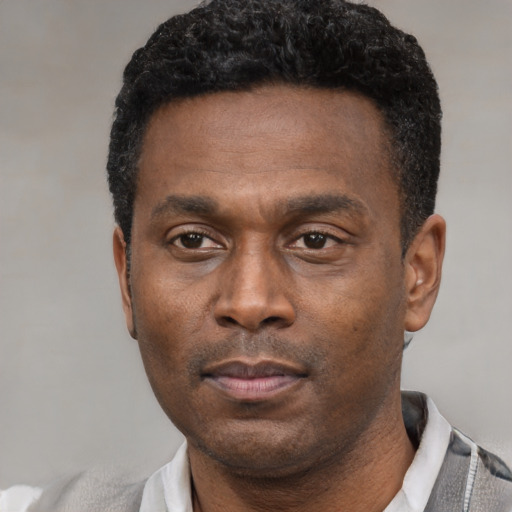 Neutral latino adult male with short  black hair and brown eyes