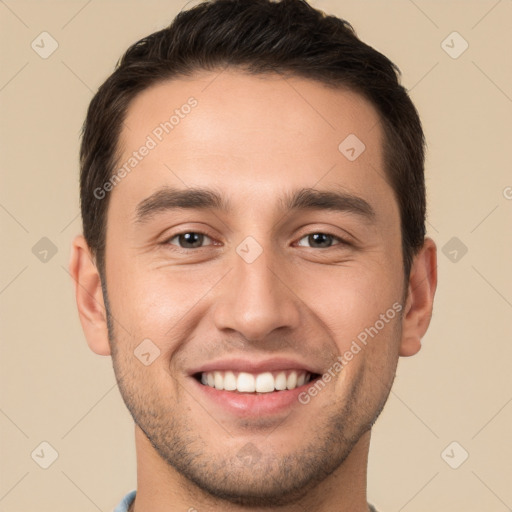 Joyful white young-adult male with short  brown hair and brown eyes