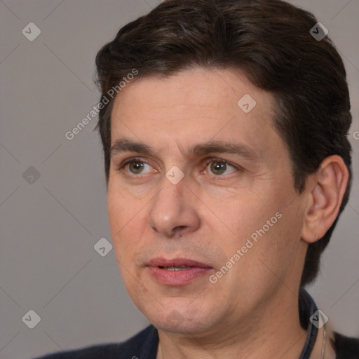 Joyful white adult male with short  brown hair and brown eyes