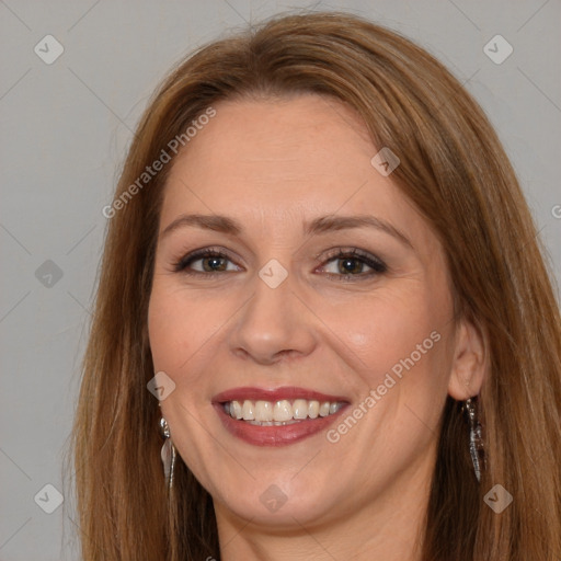 Joyful white adult female with long  brown hair and brown eyes