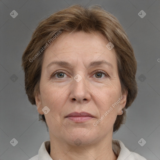 Joyful white adult female with medium  brown hair and grey eyes