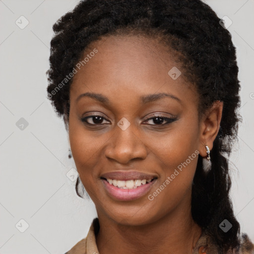 Joyful black young-adult female with long  brown hair and brown eyes