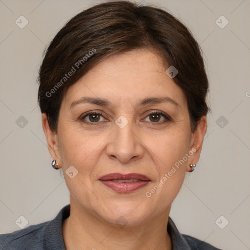 Joyful white adult female with short  brown hair and brown eyes