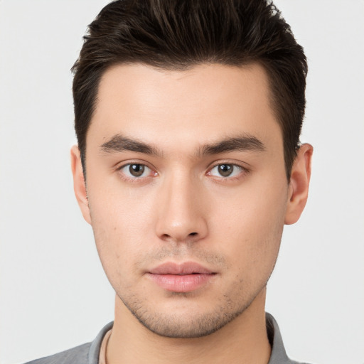 Neutral white young-adult male with short  brown hair and brown eyes