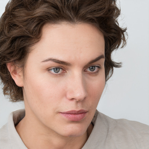 Neutral white young-adult female with medium  brown hair and blue eyes