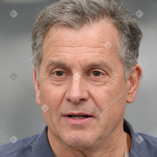 Joyful white middle-aged male with short  brown hair and brown eyes